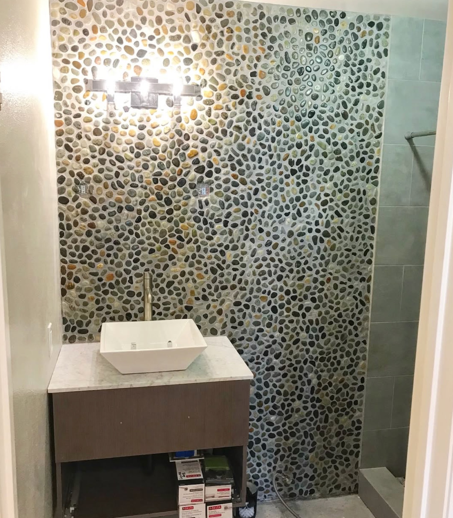 Bathroom sink with tile wall
